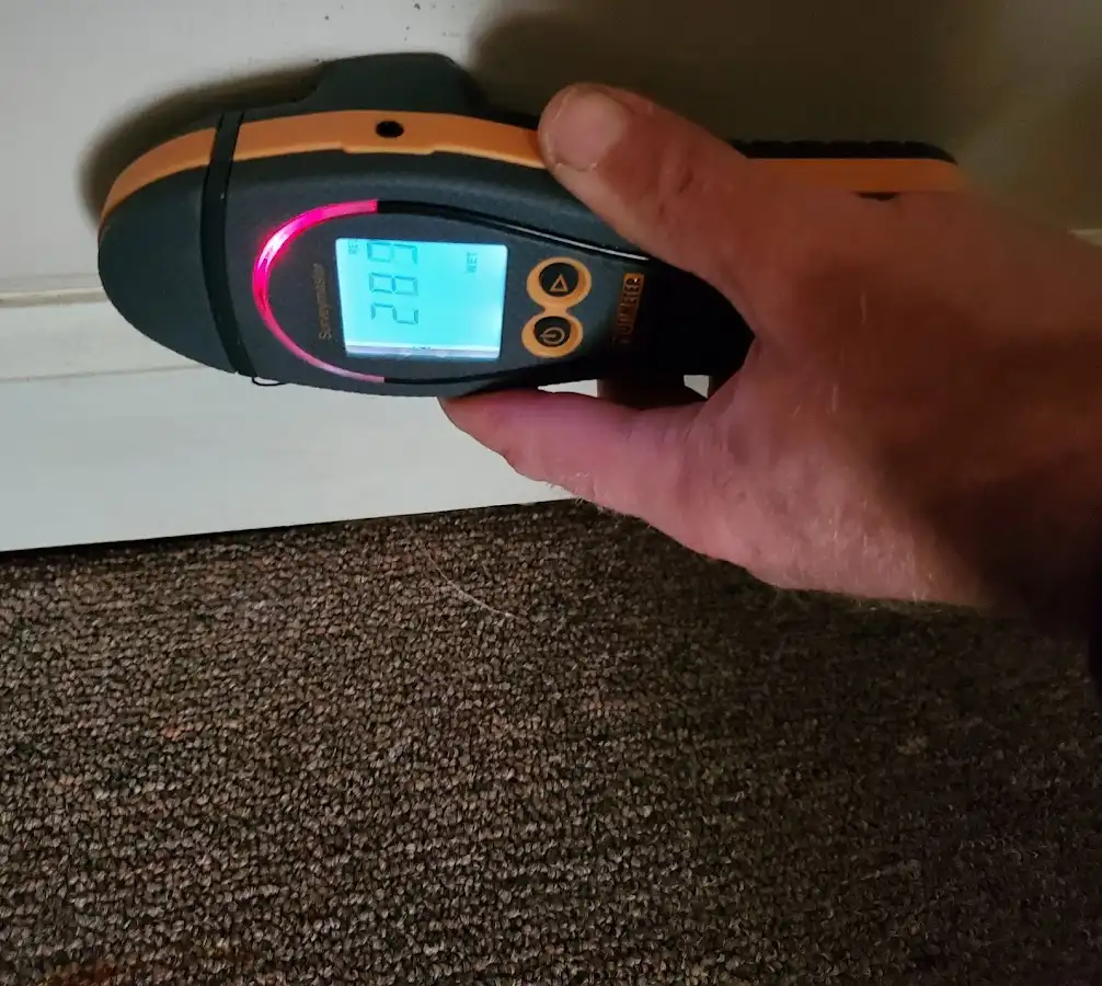 Moisture detection at baseboard during Storm Damage Restoration in Antioch